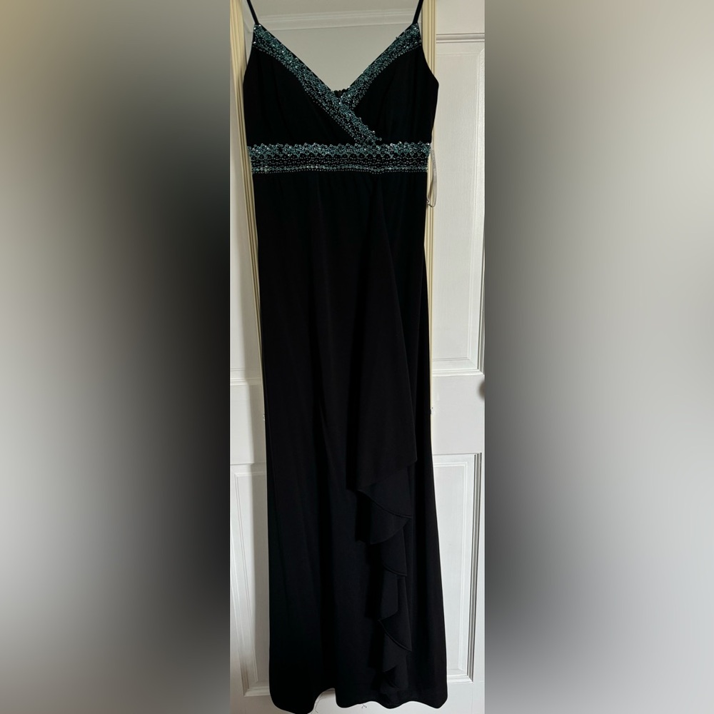 Black cascading ruffle gown with turquoise accents
